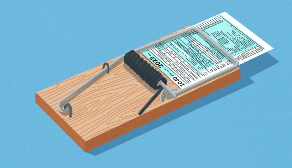 Is your tax preparer a fraud? a wooden mousetrap with a 1040 tax form snapped shut in it